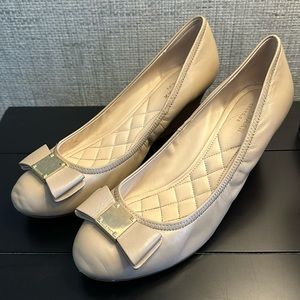 Cole Haan wedges with bow and gold plate at toe. In good condition size 8.